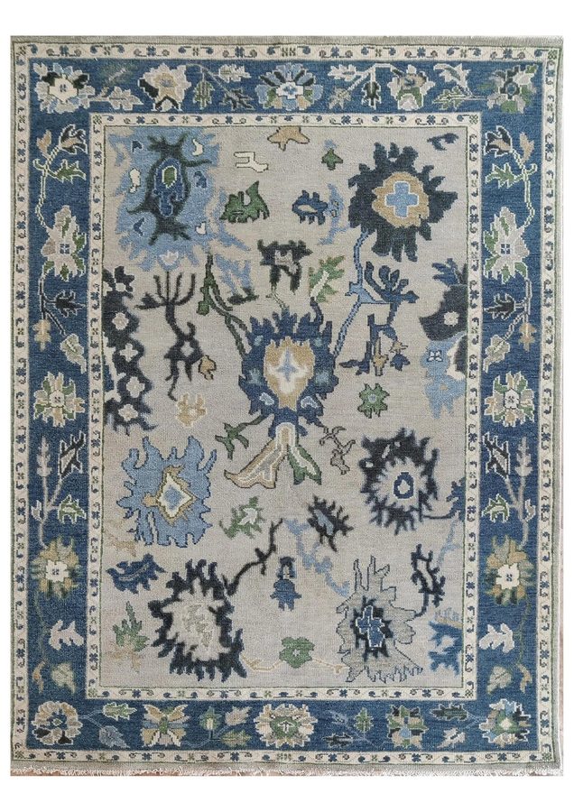 Storm Oushak — hand-knotted Oushak rug with navy florals on cool grey