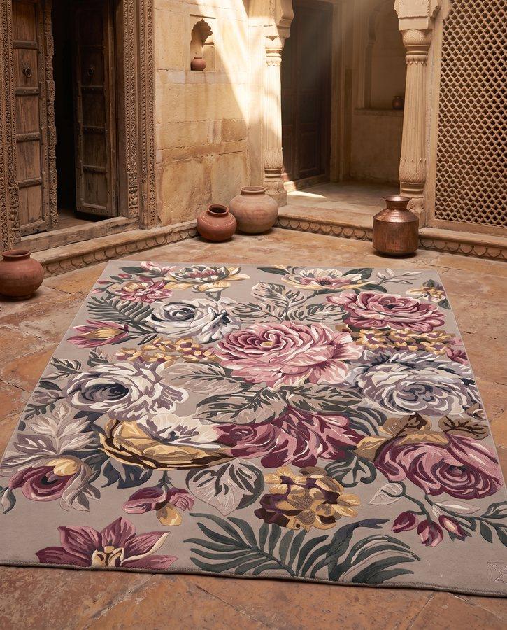Hand-tufted floral rug laid in a sunlit Indian haveli entrance