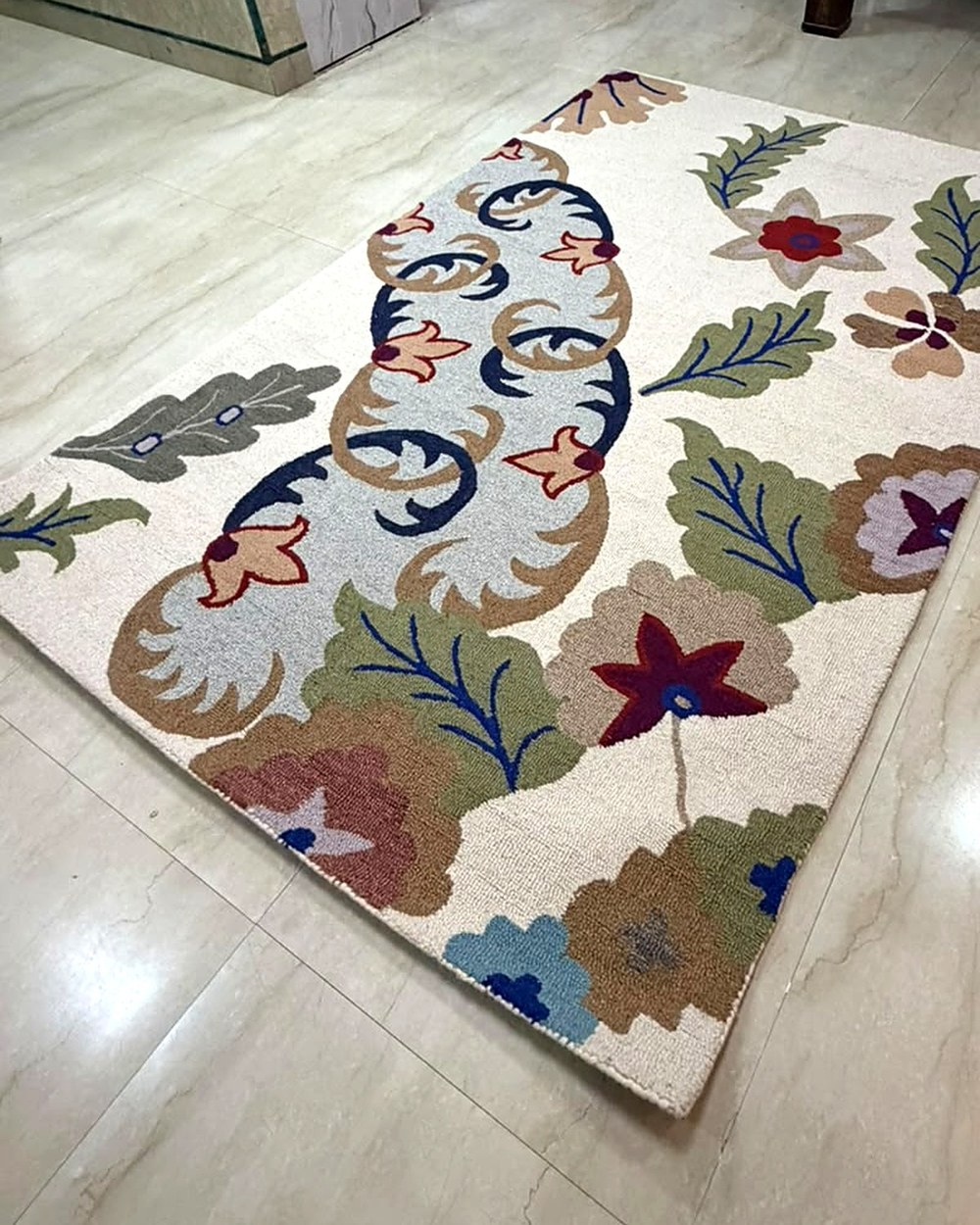 Cream floral hand tufted wool rug in a customer's home in New Delhi